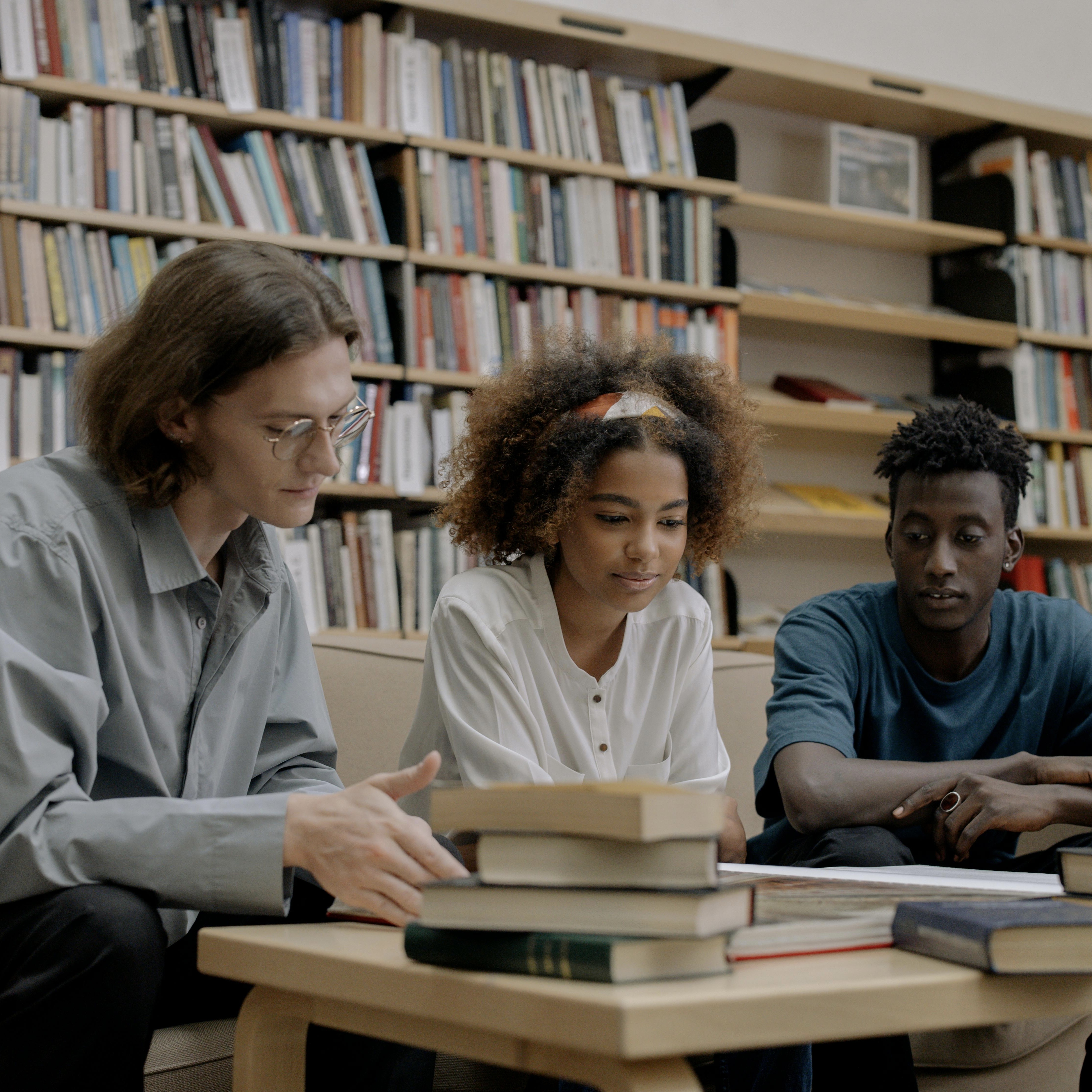 A group of students reading books.