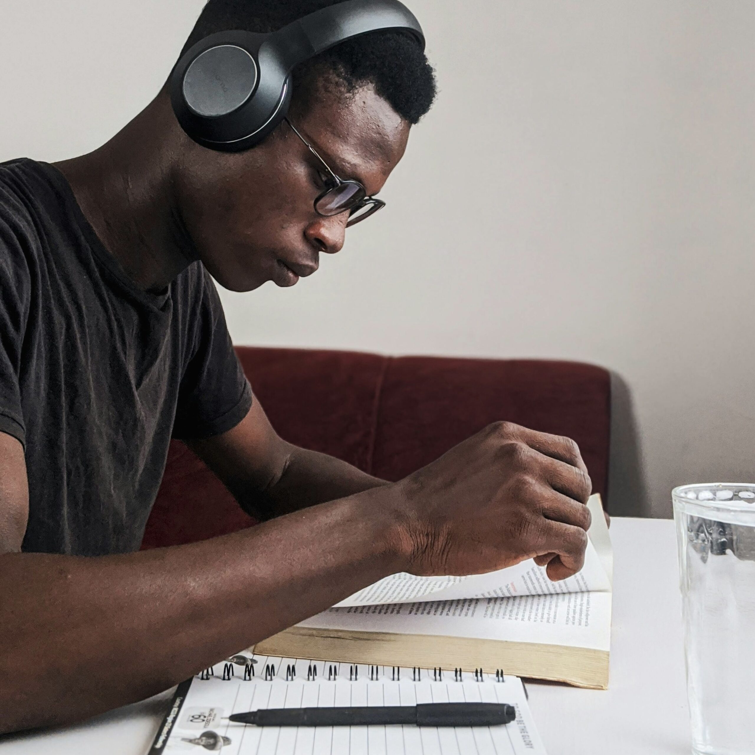 Male student reading a book.